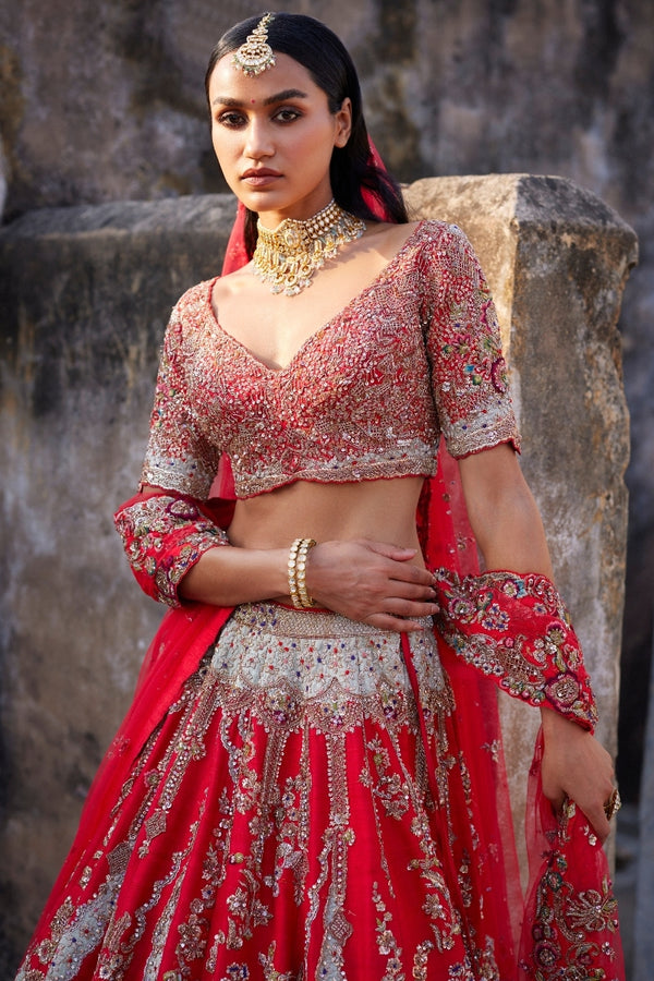 Photo of Bride in Bright Red Lehenga and Contrasting Jewellery